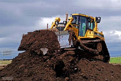 Dozer pushing dirt