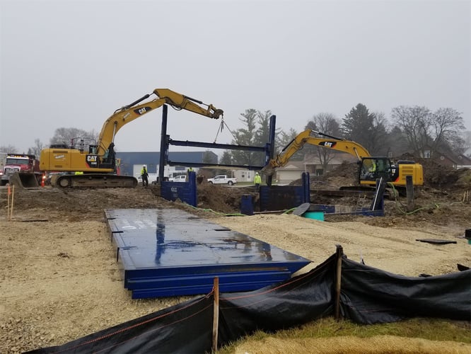 excavator bringing down a building